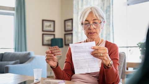 Woman reads medication leaflet